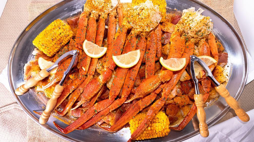 Big Island Gold · Three clusters (eight to ten oz.), 12 shrimps, two sausages, two corn, potatoes.