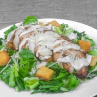 Cajun Chicken Caesar Salad · Grilled Cajun chicken breast over romaine lettuce with Caesar dressing and Parmesan cheese, ...