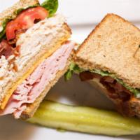 Classic Club · Three layers on toasted wheat - smoked ham, cheddar cheese, turkey, crisp bacon, lettuce, an...
