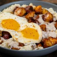 Southern Bowl · A bowl that begins with creamy grits and home fries then topped with savory sausage crumbles...