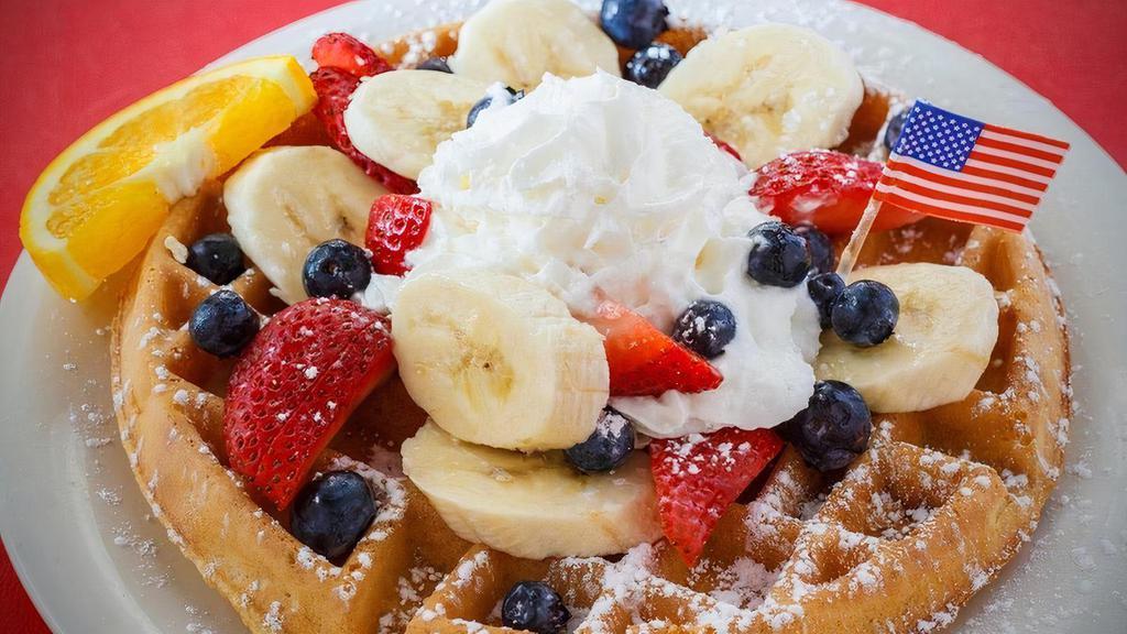 Red, White & Blue Waffle · Belgian waffle topped with strawberries, bananas and blueberries, powdered sugar and whipped cream.