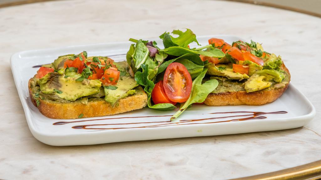 Avocado Toast · Avocado on your choice of baguette or sourdough bread with lime juice, olive oil and cilantro.