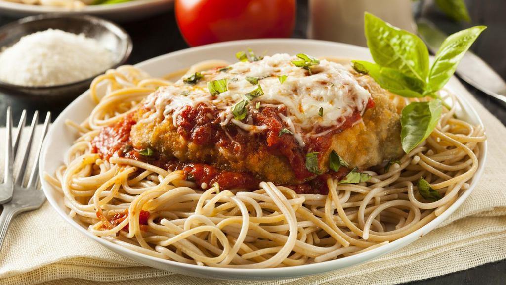 Chicken Parmesan · Lightly breaded chicken breast smothered in a signature marinara sauce and topped with Parmesan and mozzarella. Oven-baked and served on a bed of angel hair pasta. Served with customer's choice of bread and salad.