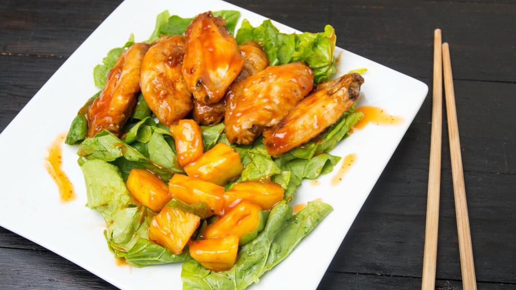 Mango Habanero Wings · Delicious wings sprinkled with special seasonings, tossed in mango habanero sauce, and baked to perfection. Served with customer's choice of dipping sauce.
