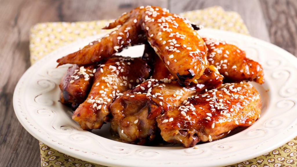 Sweet Teriyaki Wings · Delicious wings sprinkled with special seasonings, tossed in sweet teriyaki sauce, and baked to perfection. Served with customer's choice of dipping sauce.