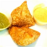Samosa · Hand-rolled pastry stuffed with Potato, Peas, Onion, and Spices.