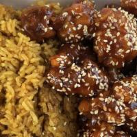 Sesame Chicken · Made with sesame seeds and broccoli. served with white rice.