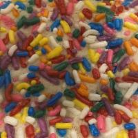 Happy Rainbow Cookie · Sugar based rolled in colorful sprinkles.