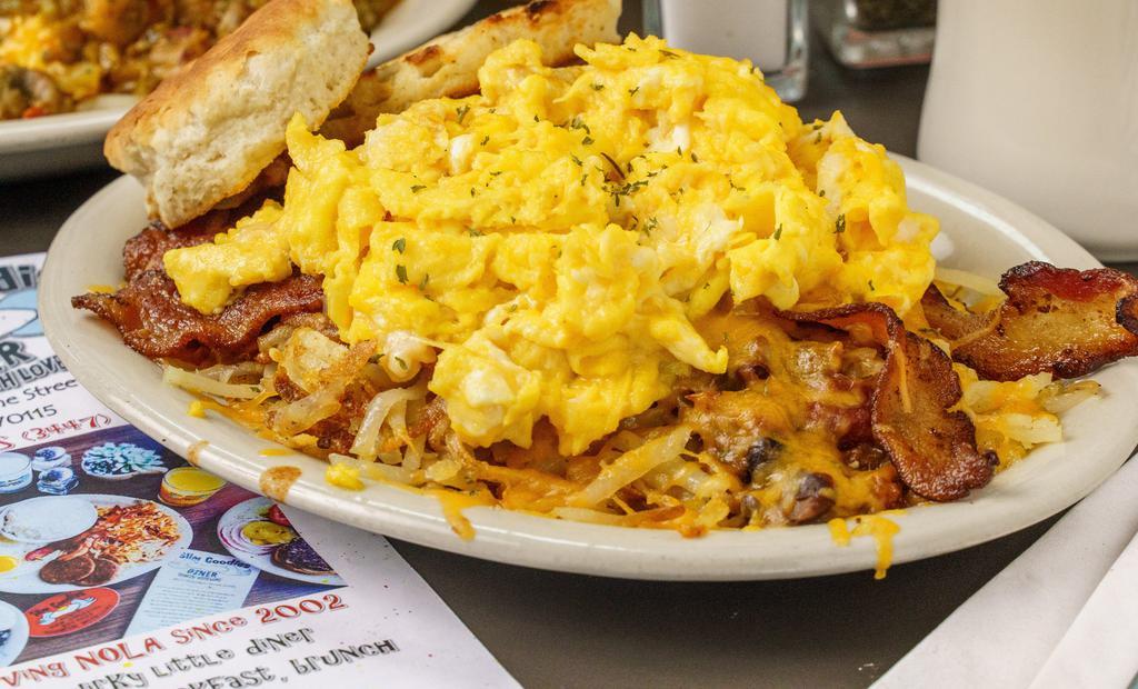 Orleans Slammer - Not Opp · A hurricane of hash browns, Slims chili, two strips bacon, two eggs & melted Cheddar, toast or biscuit, a hangover chaser extraordinaire