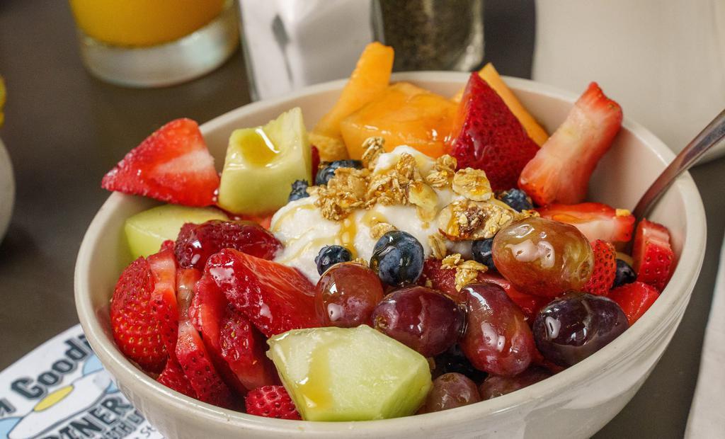 Granola Fruit Parfait · A big beautiful bowl of fresh seasonal fruit and melon, Granola with raisins, (sometimes without), and low fat yogurt - all combined and drizzled with honey....