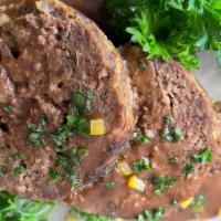 Meat Loaf · Sliced Meatloaf in brown gravy served with choice of two sides.