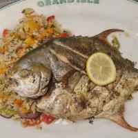 Whole Fish Pompano · Whole Pompano (Head to tail) Baked or Fried,served with Toasted Aromatic Vegetable Rice