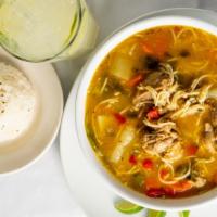 Chicken Soup / Sopa De Pollo · Traditional Dominican chicken soup served with white rice and lime.