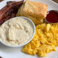 Egg Plate · 2 Eggs Any Style, Cheese Grits, Buttermilk Biscuit, Jam, Choice of Bacon or Sausage.