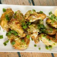 Garlic Parmesan Wings · Delicious wings sprinkled with special seasonings, tossed in a garlic Parmesan sauce, and ba...