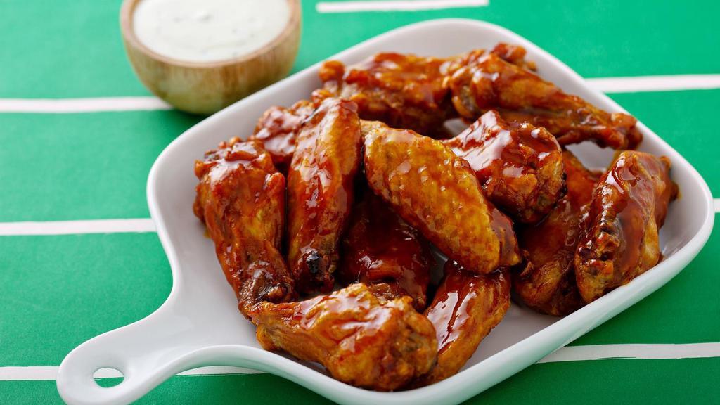 Golden Glaze Wings · Delicious wings sprinkled with special seasonings, tossed in golden glaze sauce, and baked to perfection. Served with customer's choice of dipping sauce.