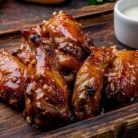 Bbq Wings · Delicious wings sprinkled with special seasonings, tossed in sweet baby ray's BBQ sauce, and...