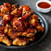 Kickin' Bourbon Wings · Delicious wings sprinkled with special seasonings, tossed in kickin' bourbon sauce, and bake...