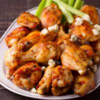 Siracha Wings · Delicious wings sprinkled with special seasonings, tossed in siracha sauce, and baked to per...