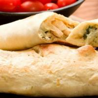 Chicken Florentine Calzone · Folded pie made with fresh dough, and stuffed with a blend of cheeses, spinach, artichoke he...
