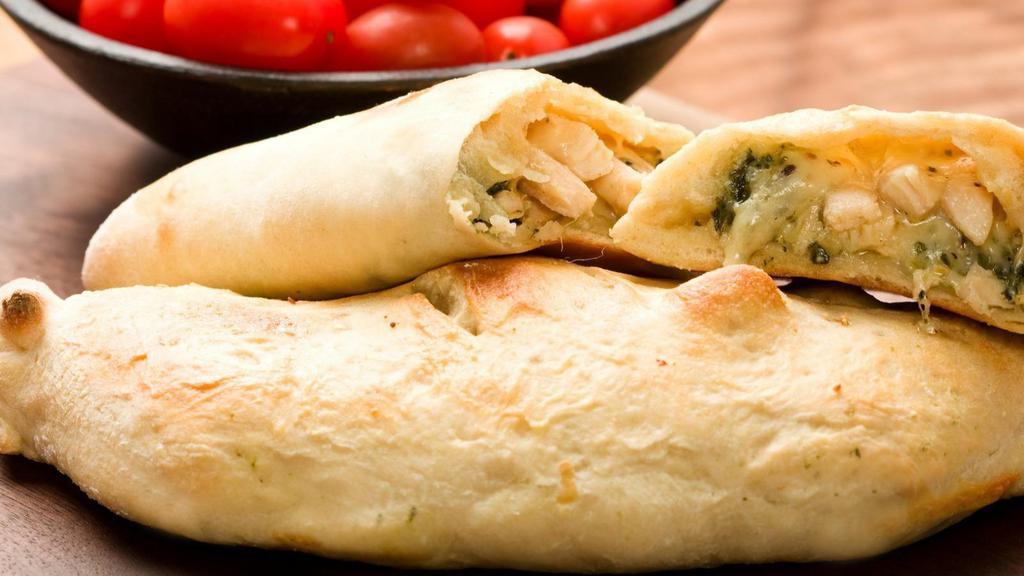 Chicken Florentine Calzone · Folded pie made with fresh dough, and stuffed with a blend of cheeses, spinach, artichoke hearts, and marinated roasted chicken breast mingled with garlic sauce, herbed ricotta, and mozzarella. Served with a house special marinara sauce.
