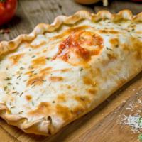 Shrimp Florentine Calzone · Folded pie made with fresh dough, and stuffed with a blend of cheeses, spinach, artichoke he...