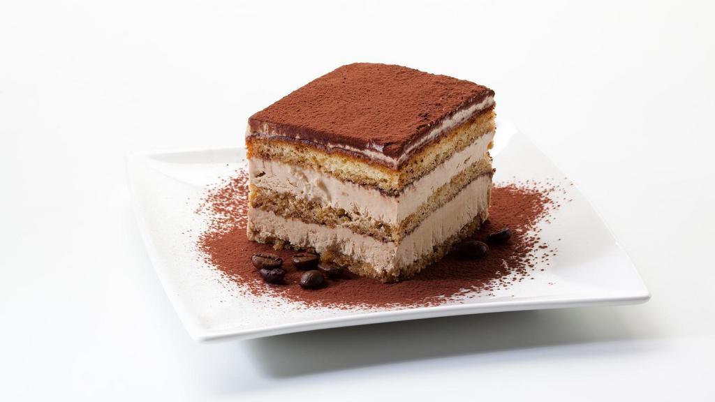 Tiramisu · Clouds of light mascarpone cream on pillows of coffee, rum-soaked ladyfingers, and finished with powdered sugar.