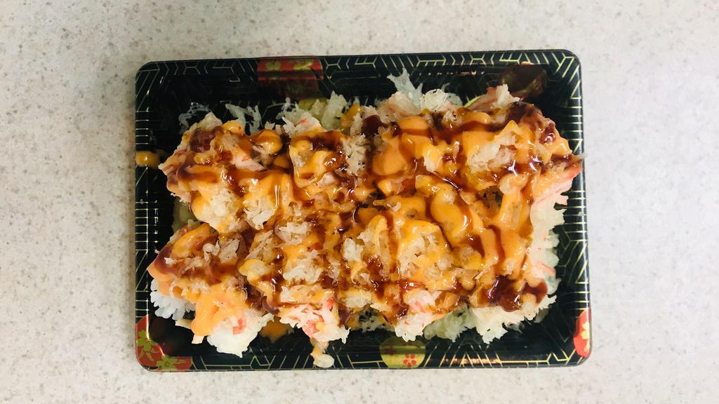 Sp17. Fantasy Roll · California roll topped with spicy crabmeat, and crispy crunch.