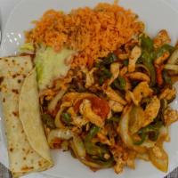 Fajitas · All varieties are served with Spanish rice, refried beans salad and corn or flour tortillas.