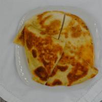 Quesadilla · Fried or grilled large flour tortilla filled with cheese.