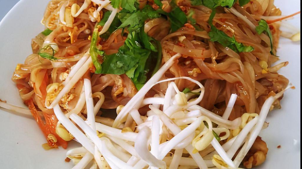 Pad Thai · Pan fried noodles with green onions, bean sprouts, carrots, and topped with crushed peanuts and cilantro.