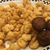Buffalo Popcorn Shrimp · Handful of popcorn shrimp hand-breaded and fried golden brown, tossed in our tangy buffalo s...