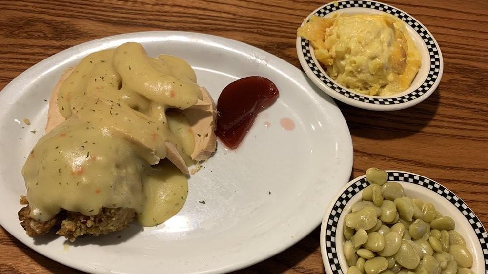 Hot Open Face Turkey · Roasted turkey breast sliced and served over bread with mashed potatoes, smothered with turkey gravy.