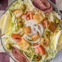 Anna'S Italian Salad · Iceberg lettuce, genoa salami, provolone cheese, tomatoes, green olives, and onions  served ...