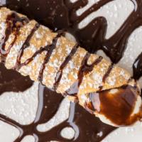 Italian Cannoli · Tube-shaped pastry shell deep fried and filled with a sweet, creamy filling and topped with ...