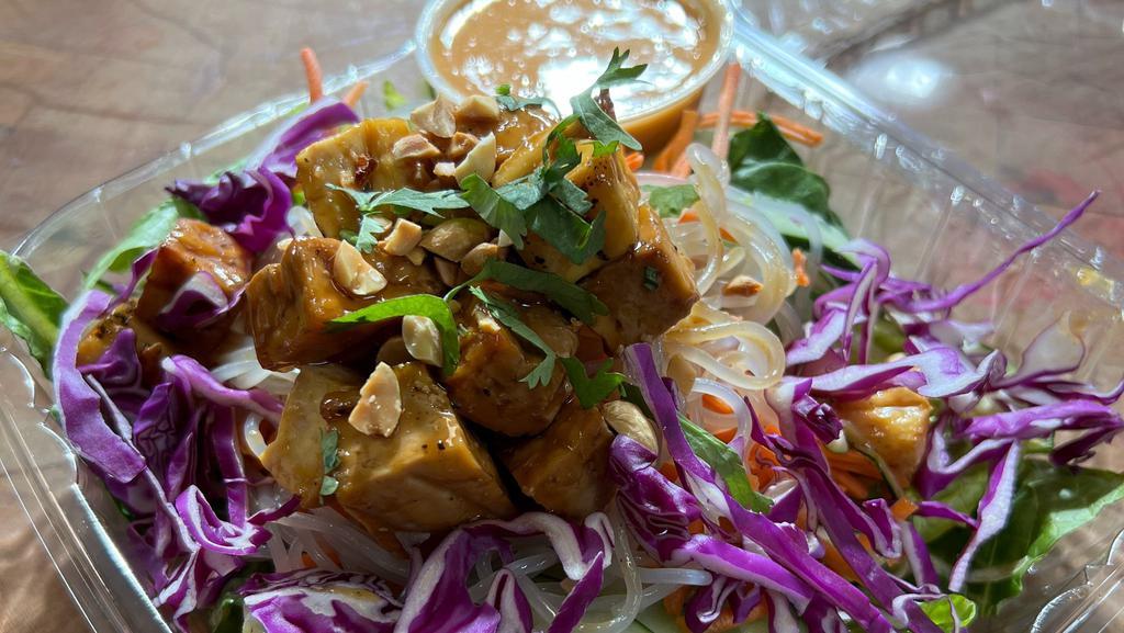 Asian Noodle Bowl With Tofu (Gluten Free) · Rice noodles, sweet and spicy cucumbers, shredded red cabbage, shredded carrots, served with spicy peanut dressing.