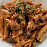 Enchilada Pasta  · Penne pasta tossed ground beef crumbles (vegan) with corn, black beans and tomatoes in our h...