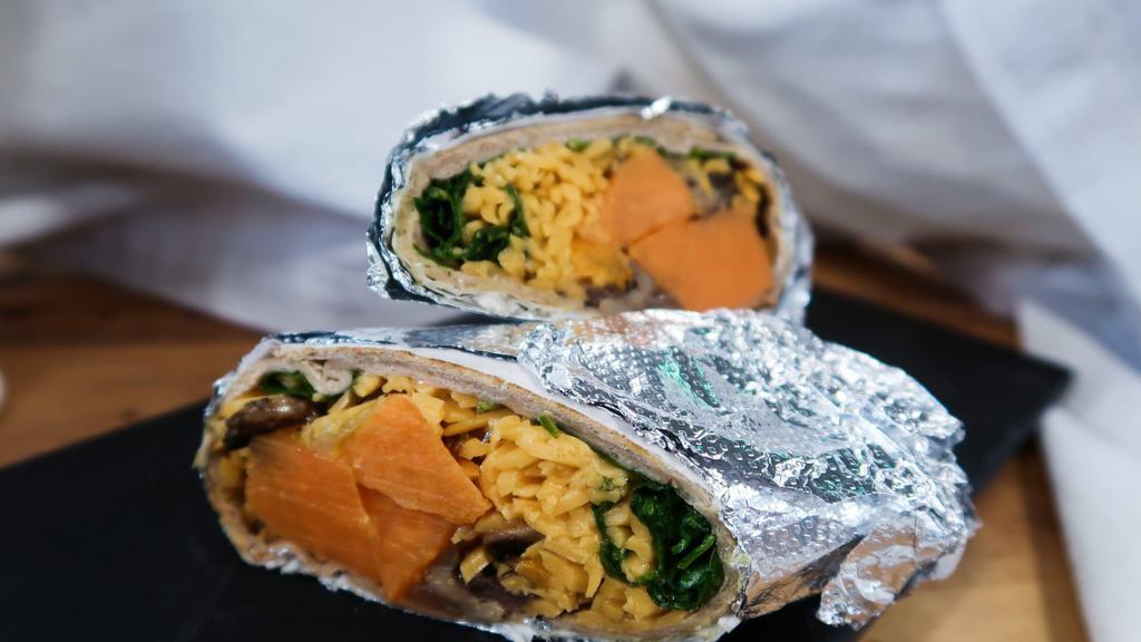 Southwest Sweet Potato Wrap · Roasted sweet potato, spinach, black beans, pickled red onion, dairy free cheddar cheese, and salsa wrapped in a whole wheat tortilla.