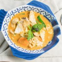 Khaeng Ped Red Curry · Thai red curry paste blended with soothing coconut milk, bamboo shoots, fresh basil, carrots...