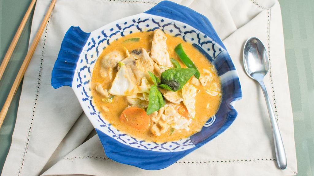 Khaeng Ped Red Curry · Thai red curry paste blended with soothing coconut milk, bamboo shoots, fresh basil, carrots, bell pepper, baby corn and mushrooms.