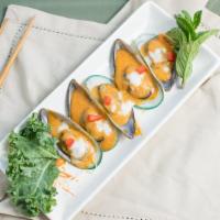 Mussels Hor Mok · Fresh, steamed mussels with our house wine butter sauce and special Thai herbs, topped with ...