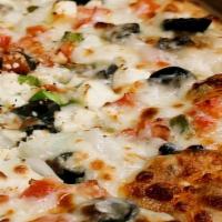 Greek Pizza · Oregano, olives, garlic, feta cheese, black olives, tomatoes, onions, and green peppers.