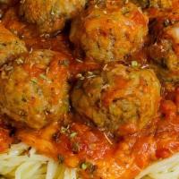 Spaghetti And Meatballs Dinner · Spaghetti and meatballs in a tomato sauce with oregano and garlic. Served with two bread sti...