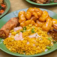 Sweet & Sour Chicken · Served with roast pork fried rice and egg roll.