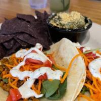 Taco Salad · Gluten-free. Seasoned pinto and black beans, organic blue tortilla chips, house salsa verde,...