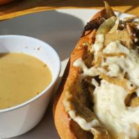 French Quarter Dip · Portabella mushrooms, onions, and BE-Hive seitan marinated in a creole seasoning; served on ...