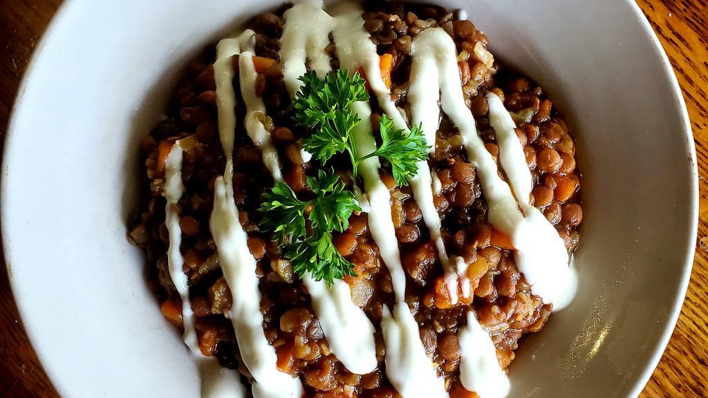 Lentil Bowl · With seasoned lentil stew, carrots, cauliflower, onions; served over organic brown rice and topped with garlic aioli.