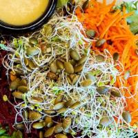 Side Salad · Gluten-free. Beets, carrots, pumpkin seeds, and sprouts with green leaf and your choice of h...