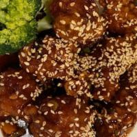 Golden Sesame Chicken · Lightly breaded and fried tossed in tangy brown sauce with sesame on top. served with an egg...