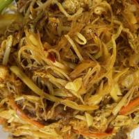 Singapore Noodles · Rice noodles stir fried with onions, cabbage, carrots, celery, scallions and eggs in spicy y...
